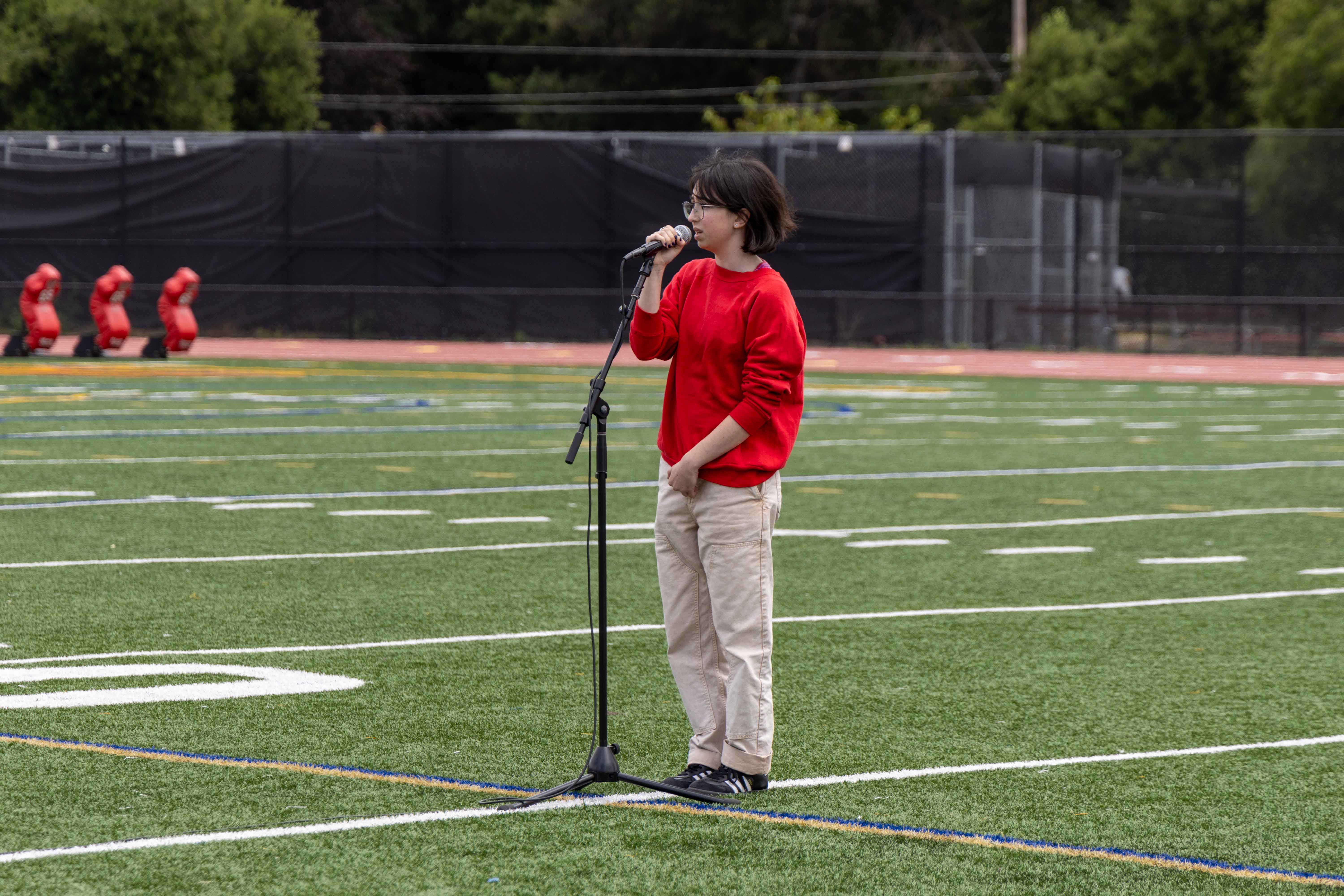 Sophomore Kealy Bryman sings the national anthem.