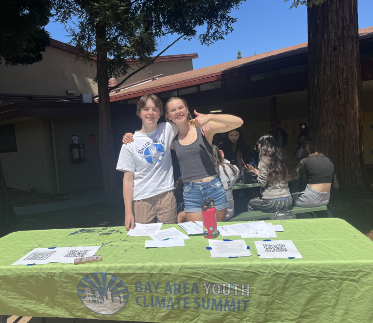 Pecore and junior Reese Glotzbach pose by their BAYCS table.