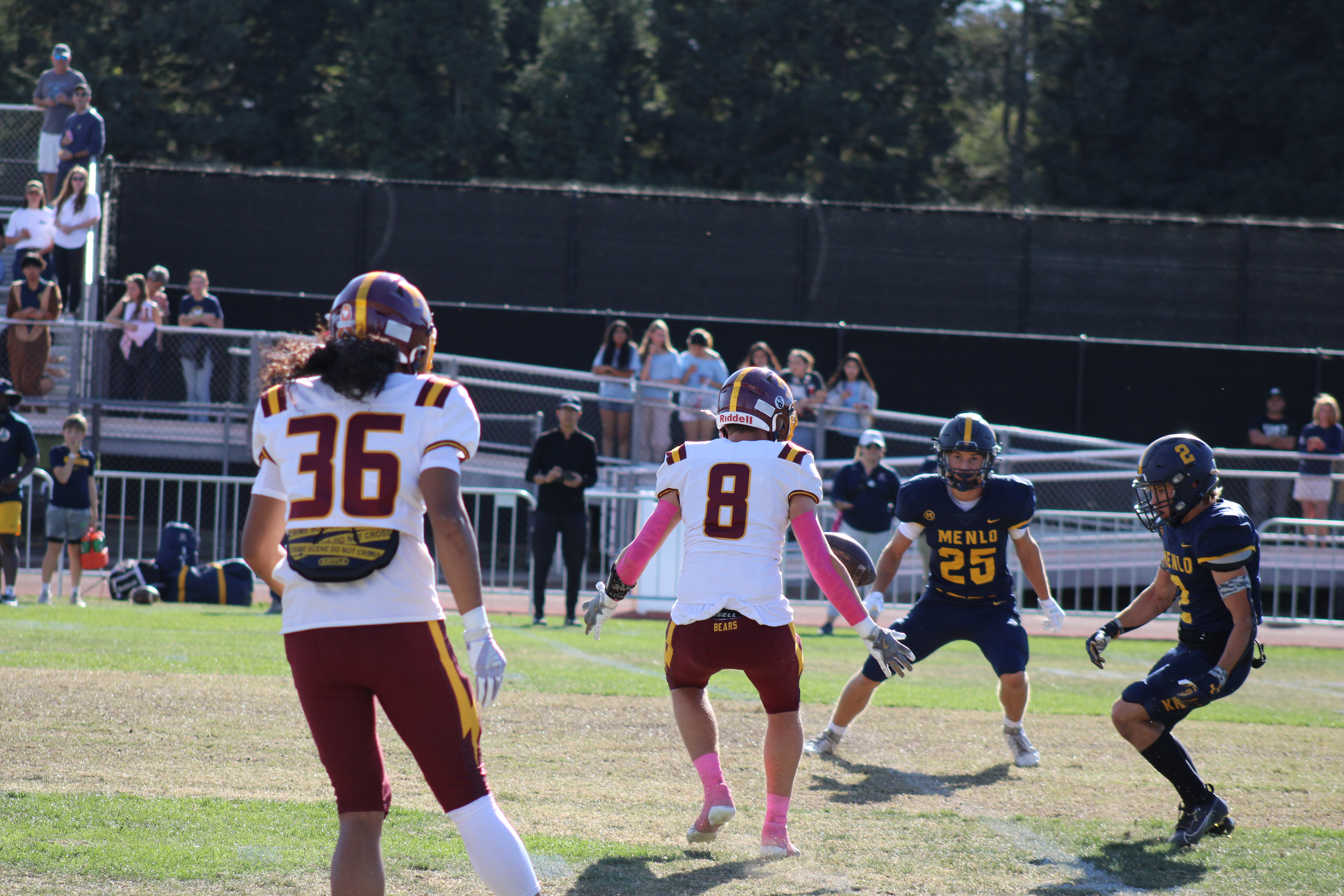 Senior tight end Jackson Harding recovers a punt that was muffed by Menlo.