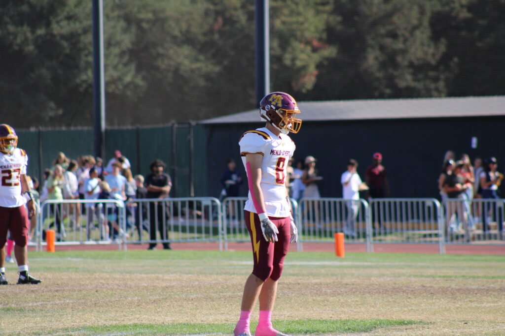 Senior tight end Jackson Harding standing on the field.