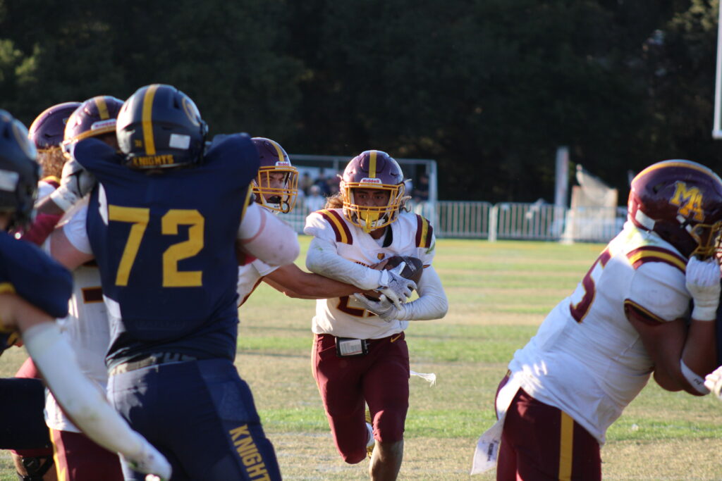 Junior running back Eva Ama rushing the ball.