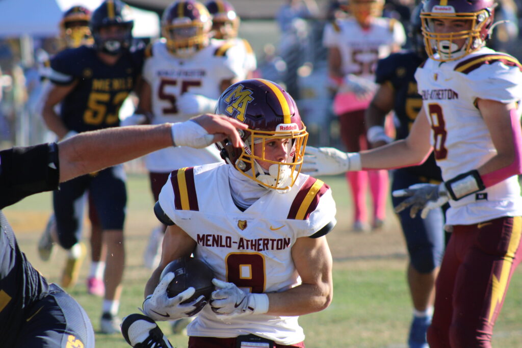 Senior wide receiver Josh Olsen running the ball after catching it.